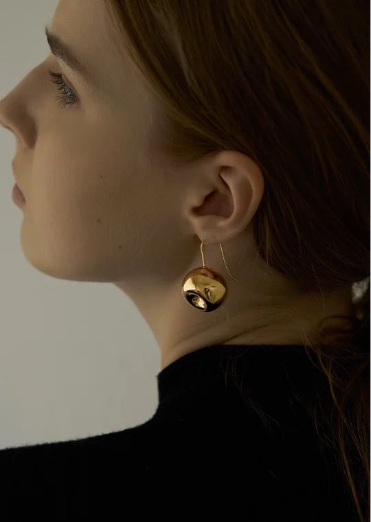 minimal gold earrings.
